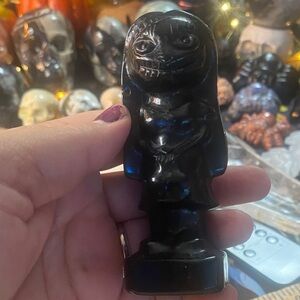 Black Figurine with Hooded Design